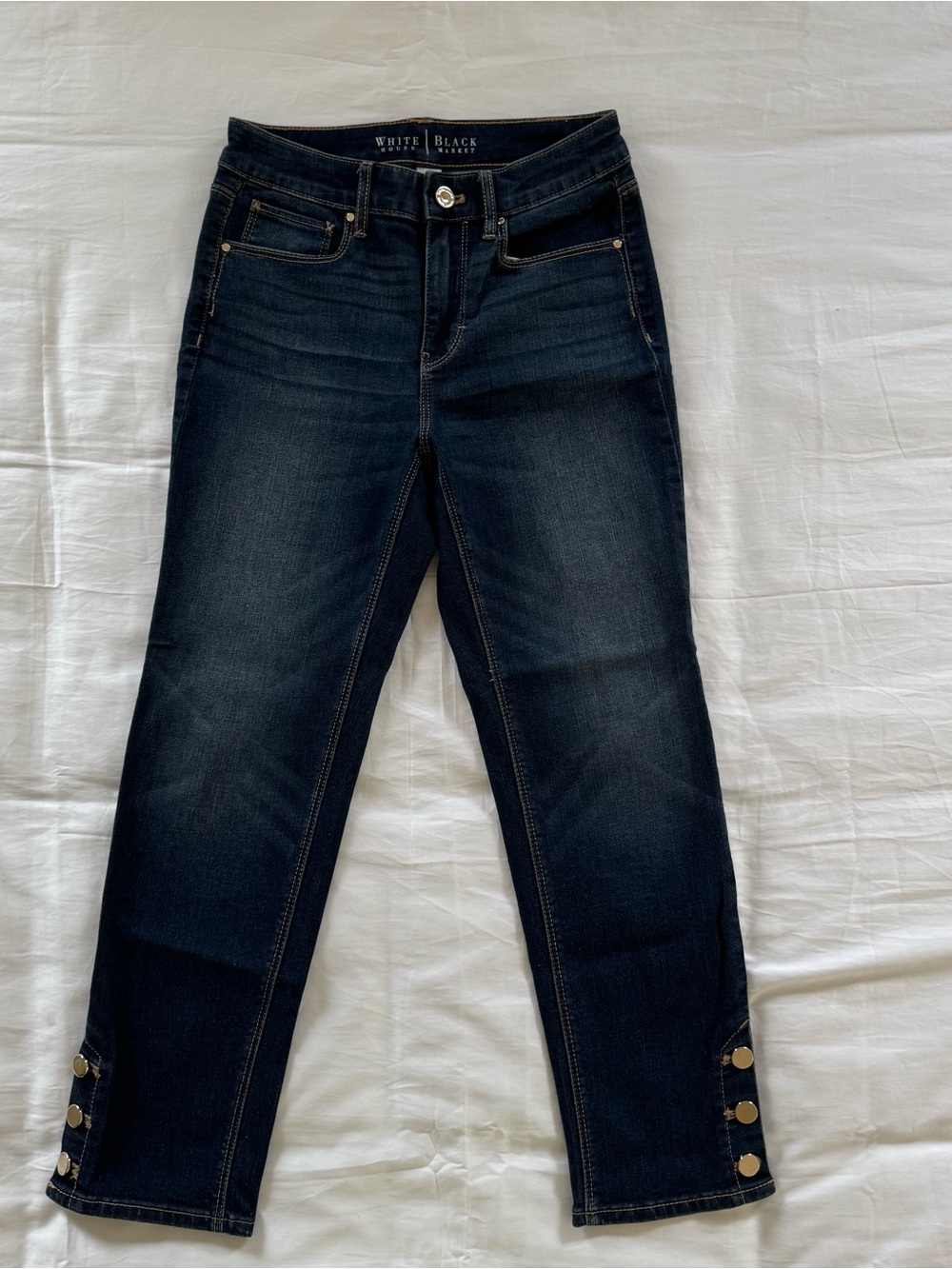 White House Black Market Dark Indigo Cropped Jeans with Gold Button Hem Detail